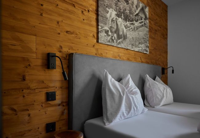Ferienwohnung in Gargellen - Zwei-Schlafzimmer-Apartment mit zwei Doppelbetten und einem Etagenbett  Ferienwohnung in Gargellen - Zwei-Schlafzimmer-Apartment mit zwei Doppelbetten und einem Etagenbett
