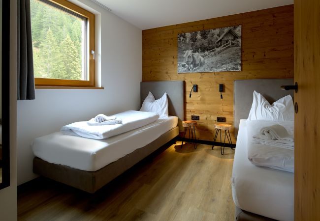 Ferienwohnung in Gargellen - Apartment mit zwei Schlafzimmer mit Doppelbett und Einzelbetten  Ferienwohnung in Gargellen - Apartment mit zwei Schlafzimmer mit Doppelbett und Einzelbetten
